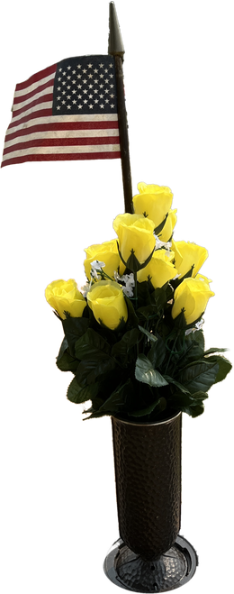 A vase of yellow roses with an American flag in memory of Sharyn Larson
